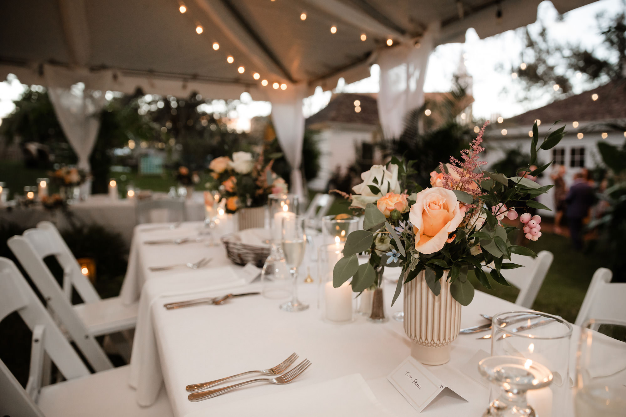 Orange and White Roses and Carnations with Ruscus and Eucalyptus Greenery Wedding Reception Centerpiece Inspiration | Tampa Bay Planner Wilder Mind Events
