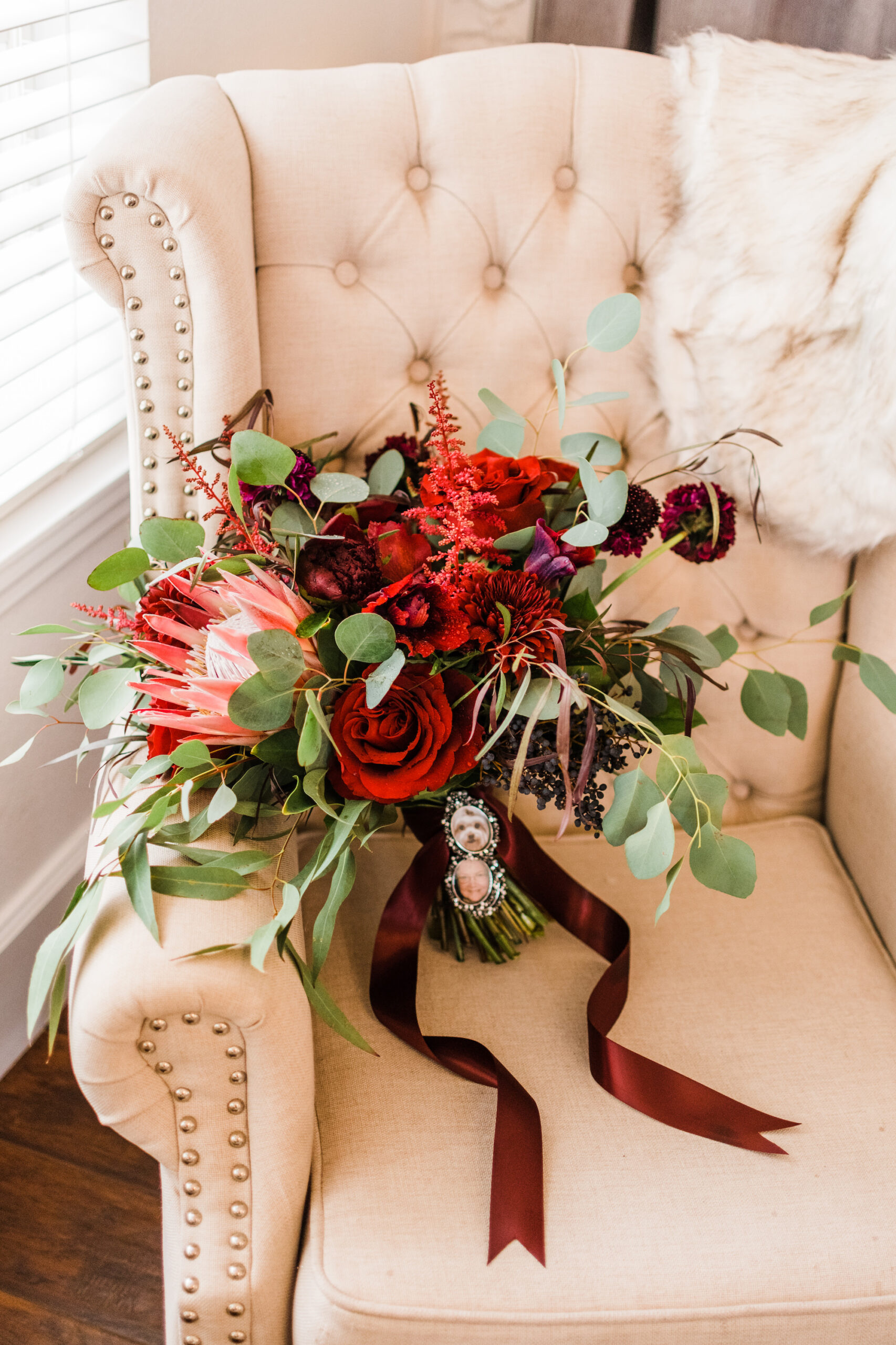 Burgundy Carnations, Roses, Crysanthemums, Pink King Protea Wedding Bouquet with Eucalyptus Greenery | Memorial Photo Charm Inspiration