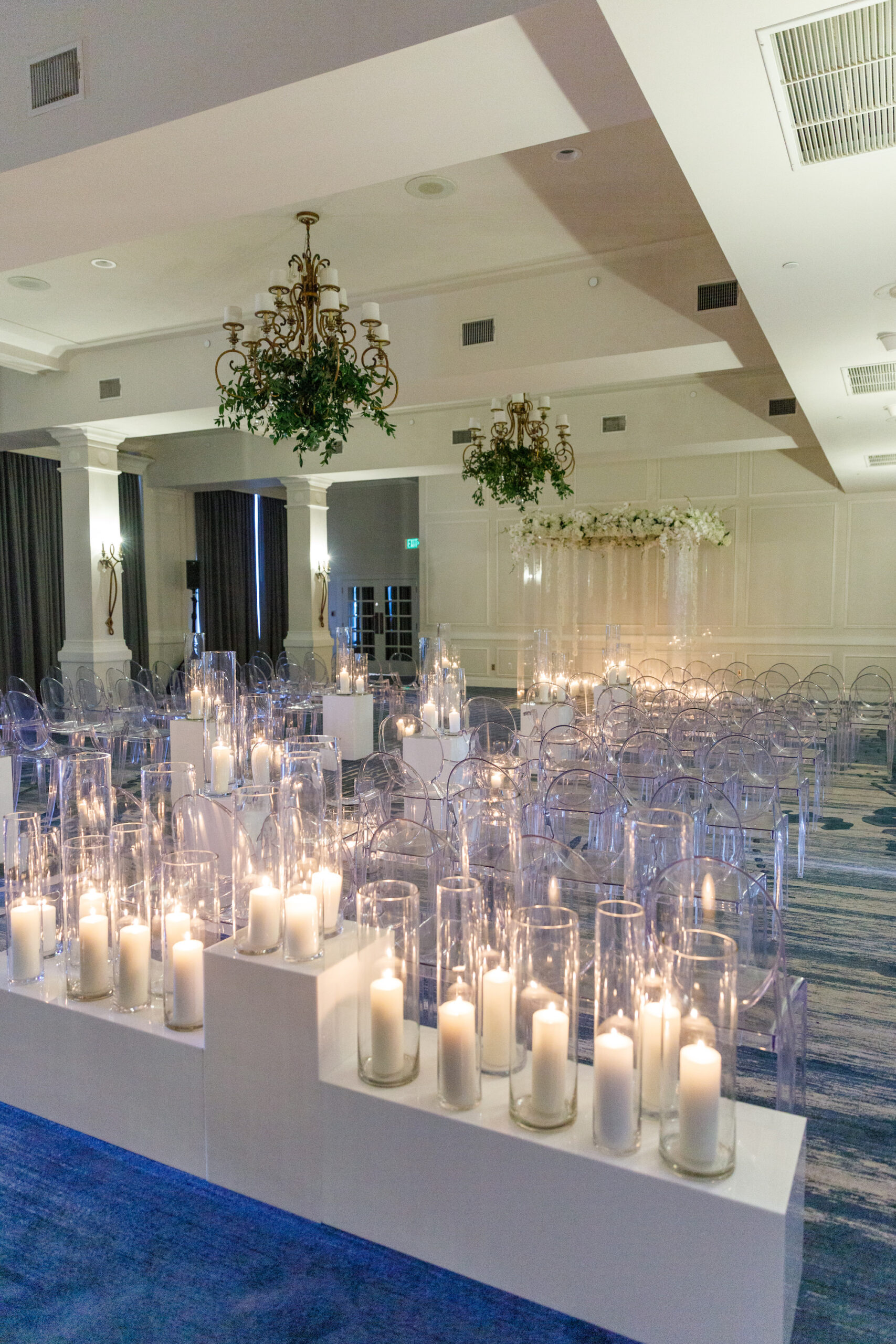 Modern Timeless Candlelit Wedding Aisle Ceremony Decor | White Pillar Candles | Ghost Acrylic Chairs Seating Inspiration | Buena Vista Ballroom Wedding Ceremony at St Pete Venue Don CeSar