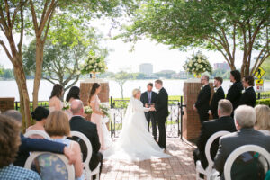 Bride and Groom Exchanging Wedding Vows | Classic Outdoor Lakefront Wedding Ceremony Ideas | Lakeland Venue Junior League Sorosis Building