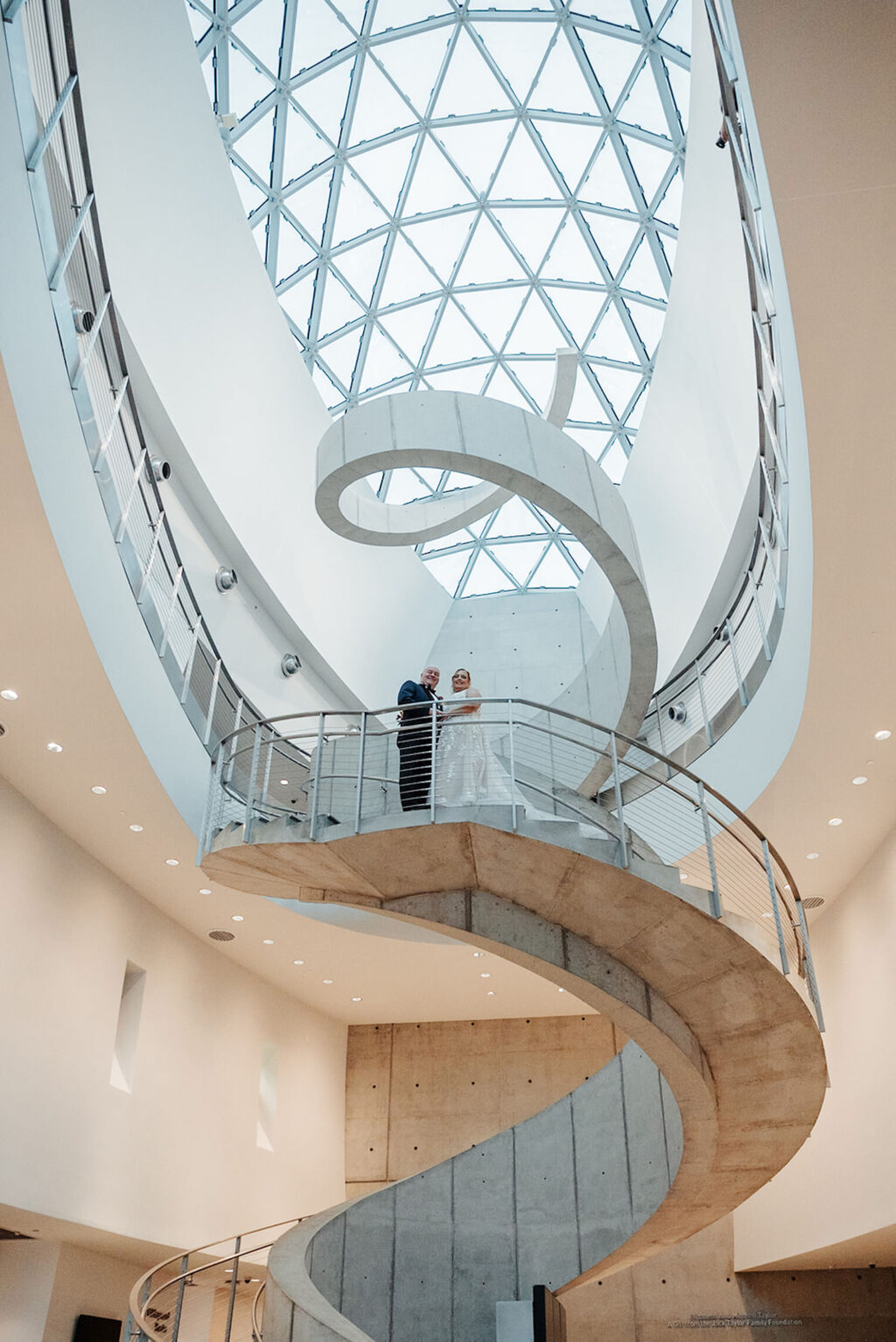 Bride and Groom on a Staircase Wedding Portrait | St Petersburg Venue Dali Museum | Planner UNIQUE Weddings & Events