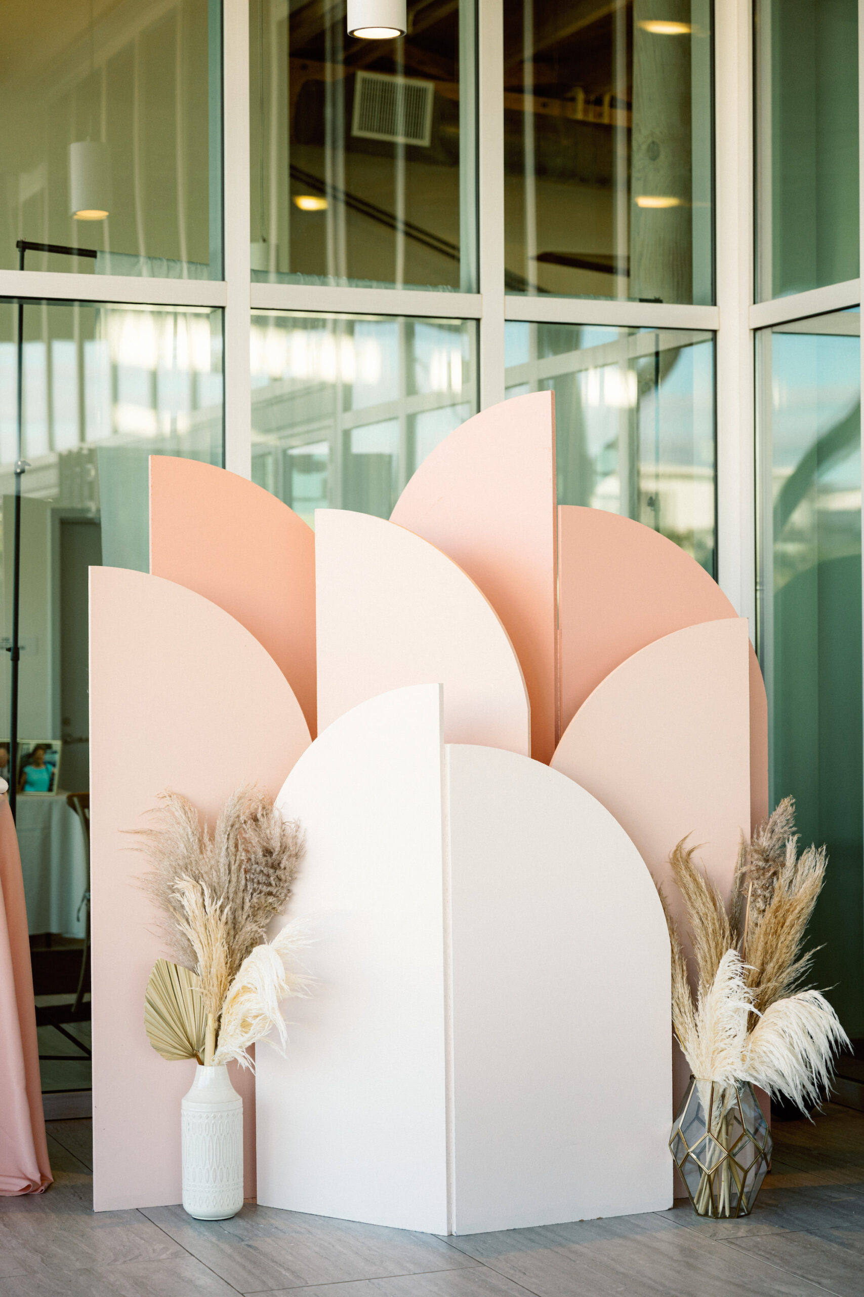 Modern Ombre Peach and Pink Pastel Geometrical Wedding Arch Reception Backdrop | Boho Pampas Grass Decor Ideas