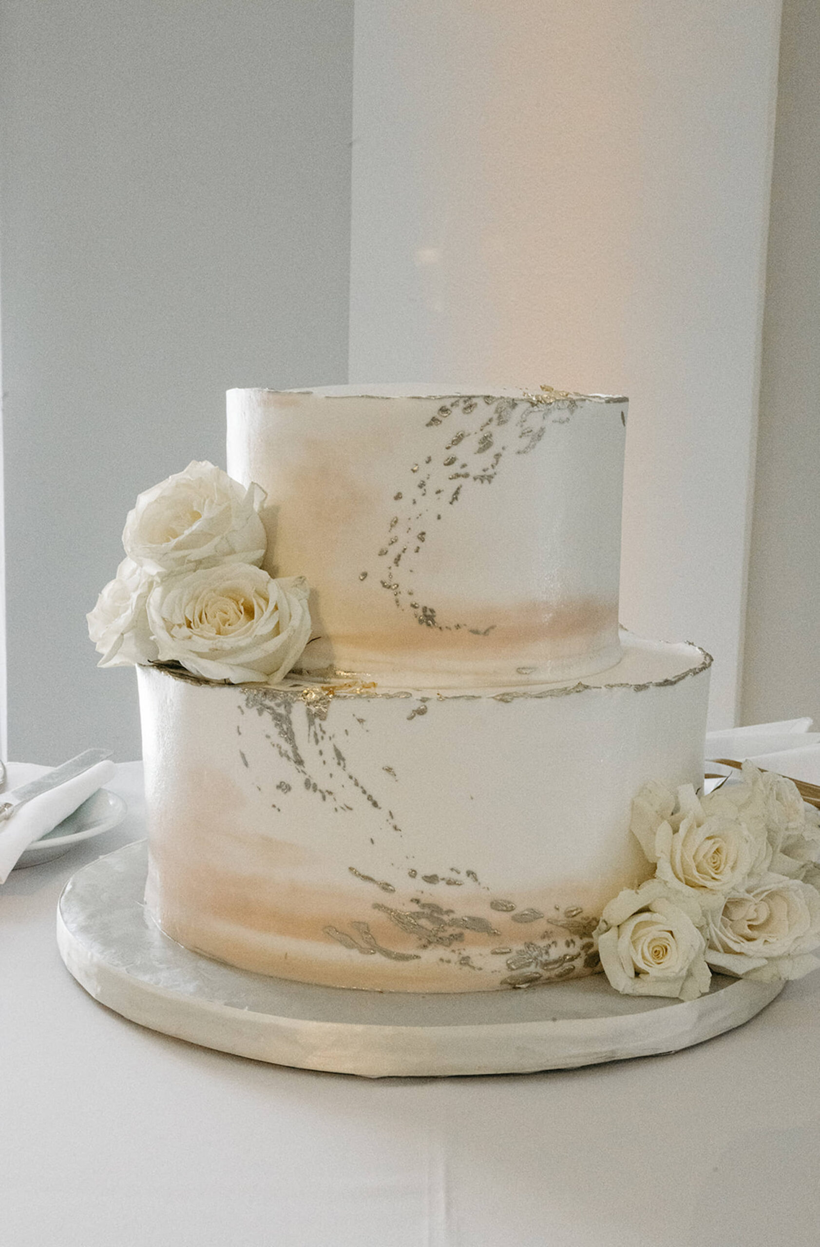 Two-Tier Gold Foil, White, and Beige Wedding Cake with White Roses Ideas