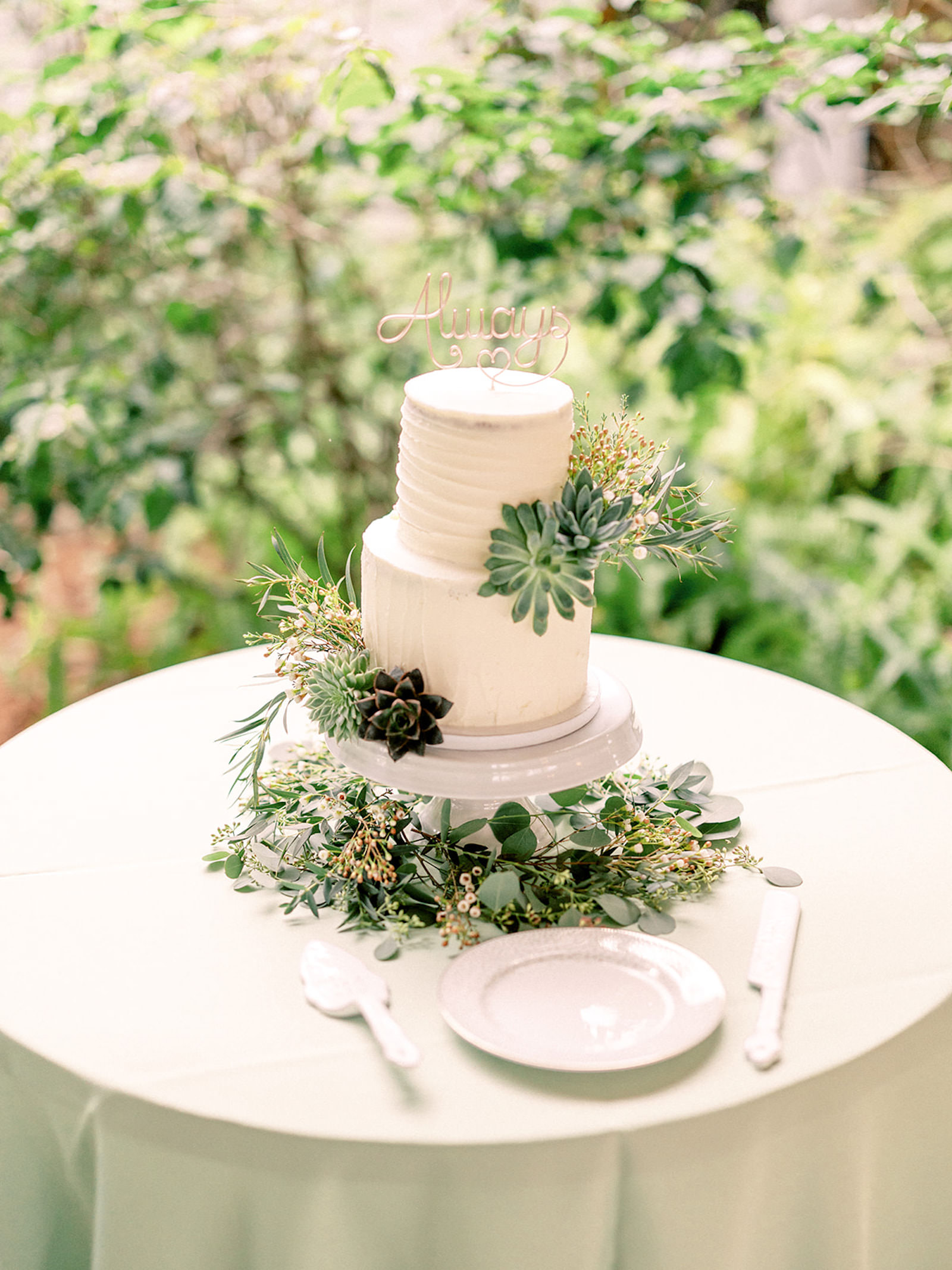 Two-tiered White Buttercream Wedding Cake with Succulants | Cake Table Inspiration