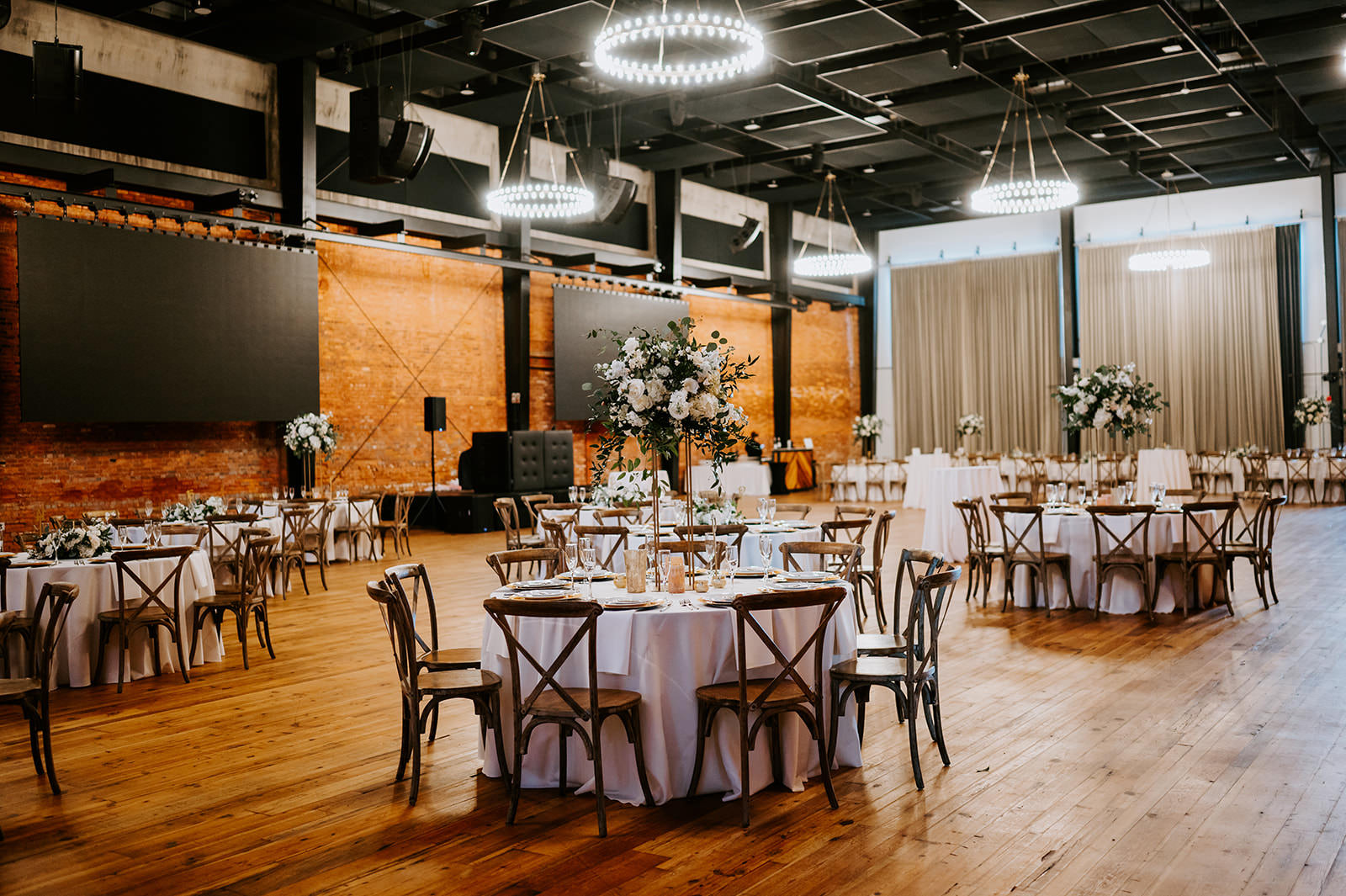 Classic Wedding Reception Table Setting Ideas | Gold Chargers | Roses, Snapdragons, Carnation Centerpiece Inspiration | Crossback Wooden Chair Seating | Tampa Heights Armature Works
