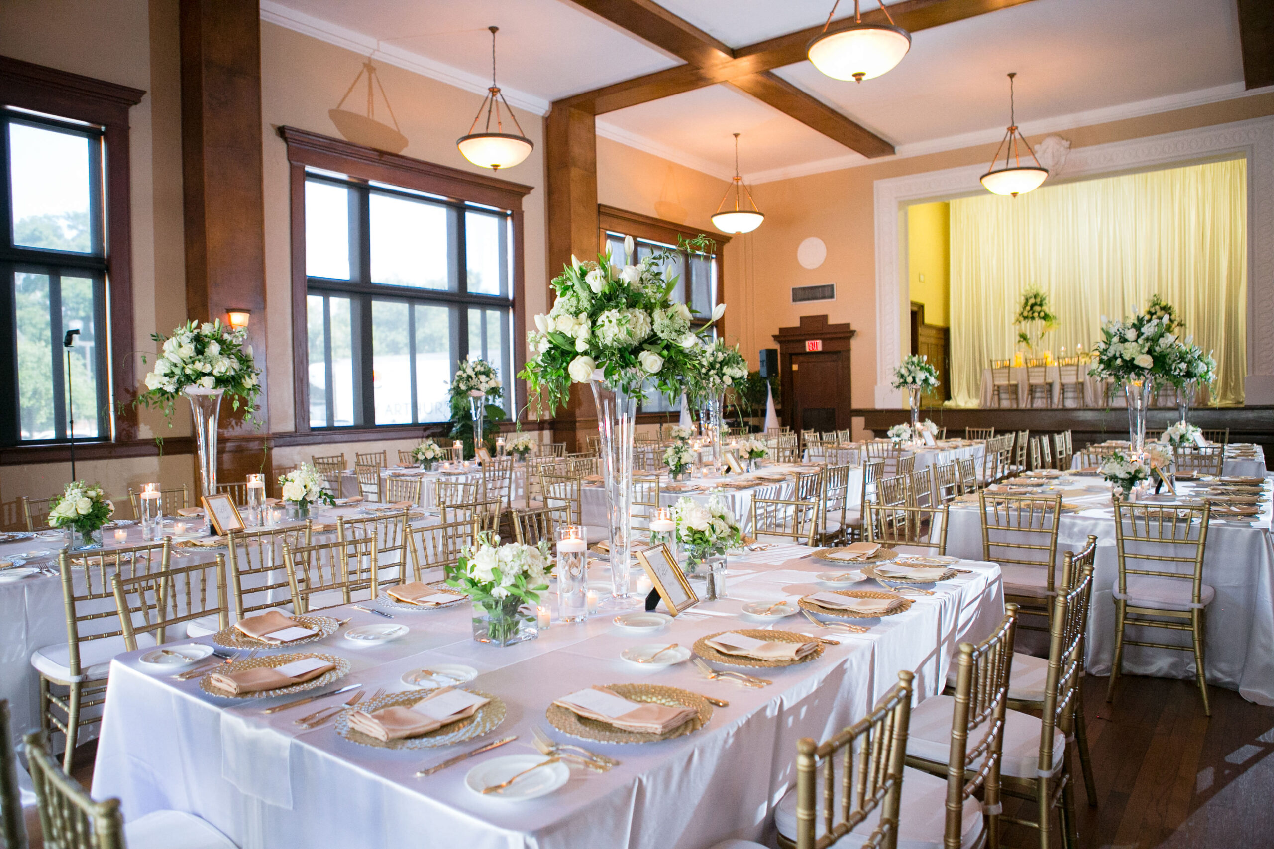 Elegant, Classic White and Gold Wedding Reception Inspiration | Satin Linen, Chiavari ChairsTall Glass Vase with White Roses, Hydrangeas, and Greenery Flower Arrangement Ideas