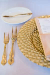 Gold Leaf Textured Chargers with Gold Flatware | White and Gold Wedding Reception Ideas