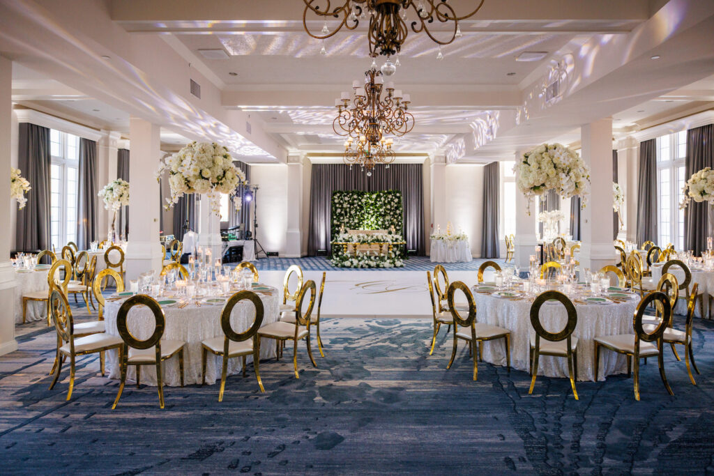 Luxurious Ballroom Wedding Reception | Modern Gold Chairs | Tall Acrylic Centerpieces with White Hydrangeas, Roses, and Orchid Flower Arrangement Ideas | St Petersburg Florist FH Events | Venue The Don Cesar