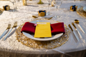 Yellow Menu Cards | Burgundy Linens | Gold and White Flatware | Colorful Wedding Reception Decor Ideas
