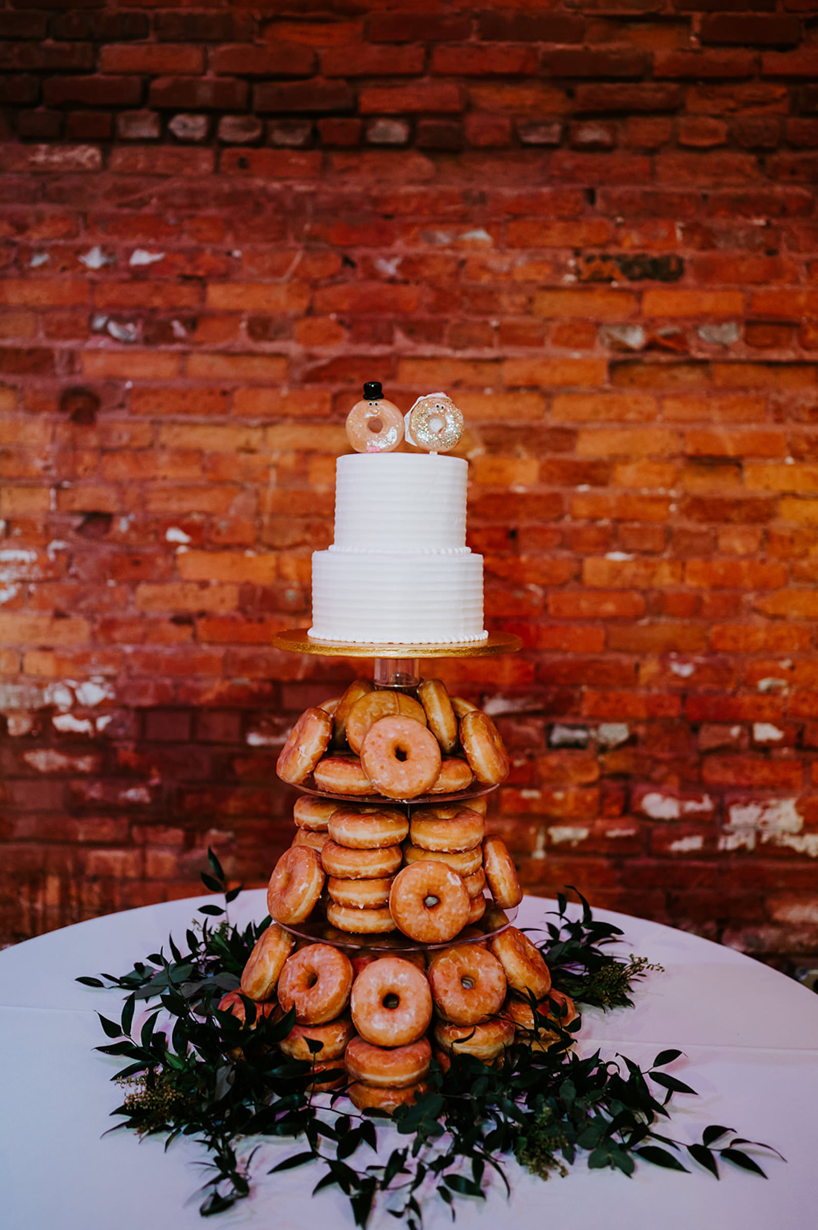 Dessert Table Inspiration | Wedding Cake Alternatives | Donut Cake Topper | White Two-tiered Wedding Cake