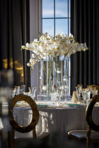 Modern Timeless Tall Glass Vases with White Orchid Centerpiece Ideas | Floating Candle Decor | White and Gold Wedding Reception Decor Inspiration