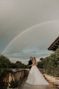 Bridal Wedding Portrait of Bride and Groom Underneath Rainbow | Central Florida Venue Howey Mansion
