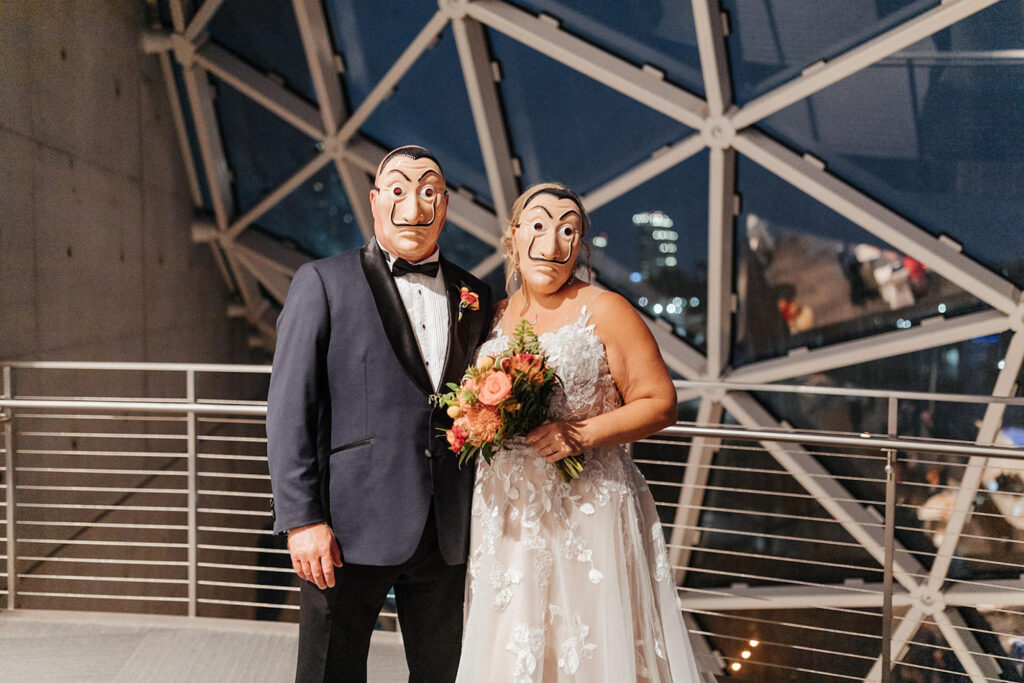 Bride and Groom in Salvador Dali Masks | St Pete Venue Dali Museum | Planner UNIQUE Weddings & Events