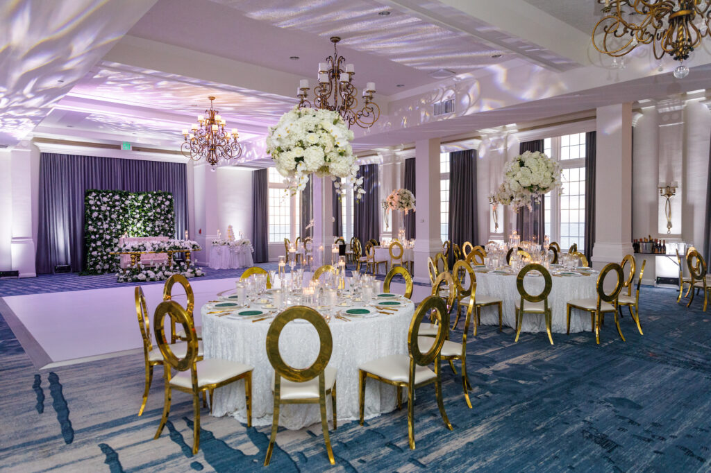 Luxurious Ballroom Wedding Reception | Modern Gold Chairs | Tall Acrylic Centerpieces with White Hydrangeas, Roses, and Orchid Flower Arrangement Ideas | St Petersburg Florist FH Events | Venue The Don Cesar