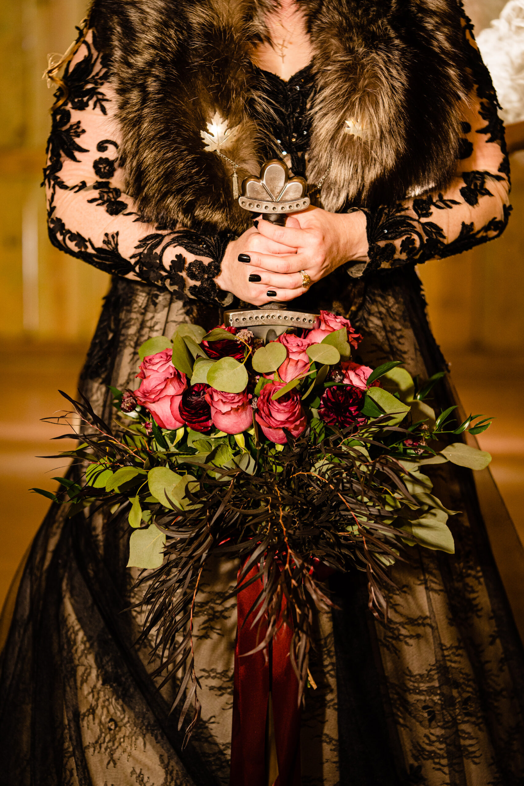 Bridal Bouquet Alternative | Viking Themed Wedding Ideas | Sword with Red Roses | Black Long Sleeve Sheer Lace A-Line Maggie Sottero Dark and Moody Wedding Dress Ideas