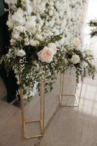 Tall Gold Flower Stand with White and Pink Roses and Ruscus Greenery Wedding Ceremony Decor Inspiration