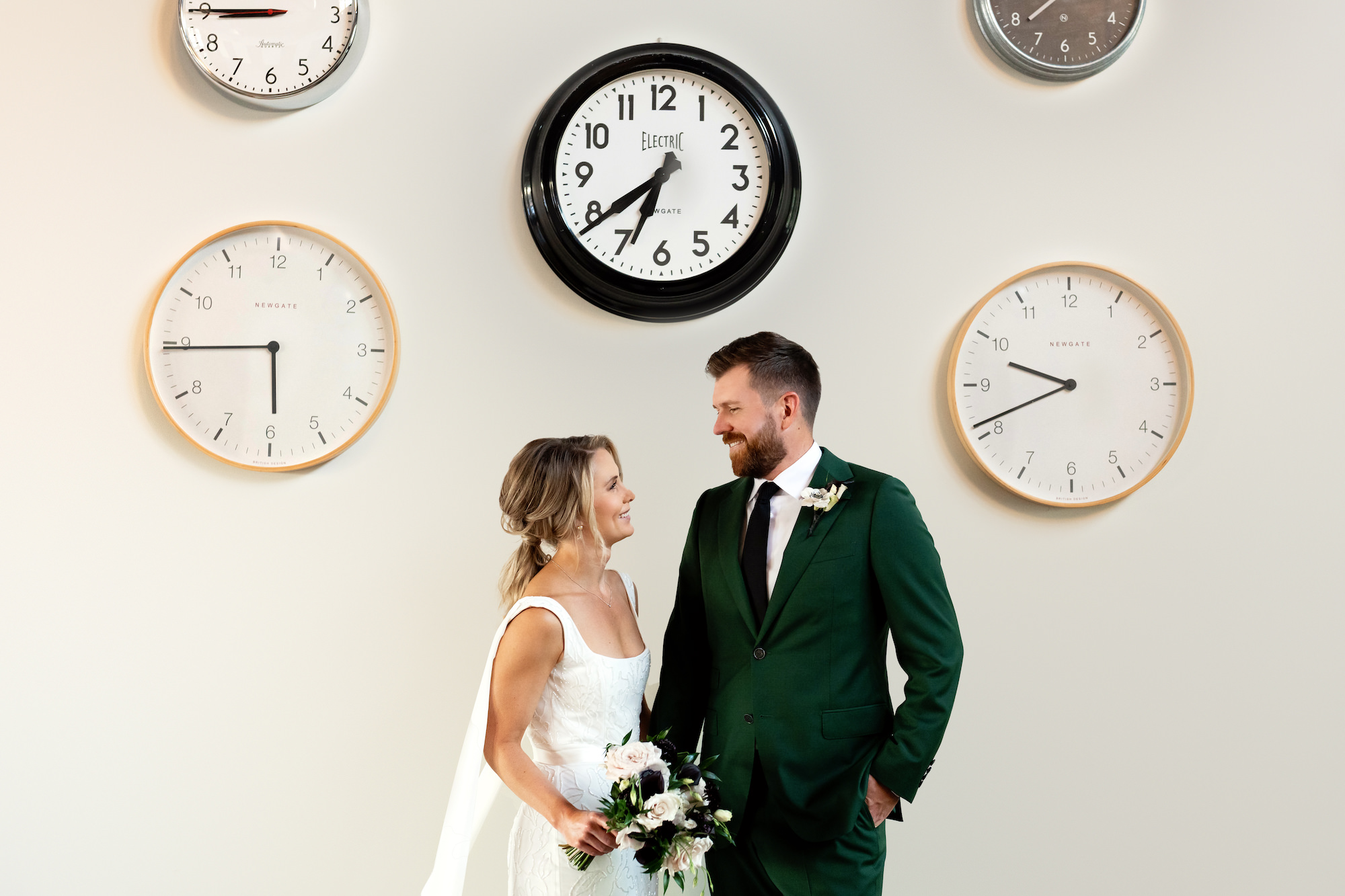 Bride and Groom First Look in Front of Clock Wall Wedding Portrait