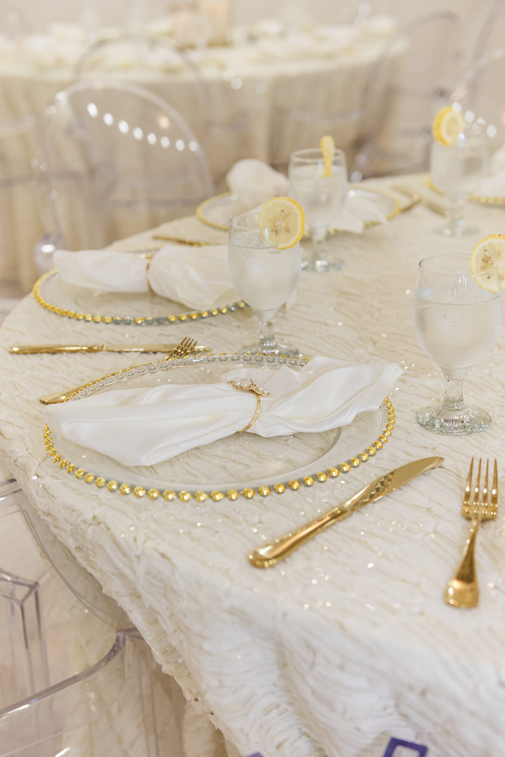 White and Gold Wedding Reception Ideas | Gold Beveled Glass Chargers and Geometric Votives | Pearl Napkin Rings | Tampa Bay Outside the Box Rentals