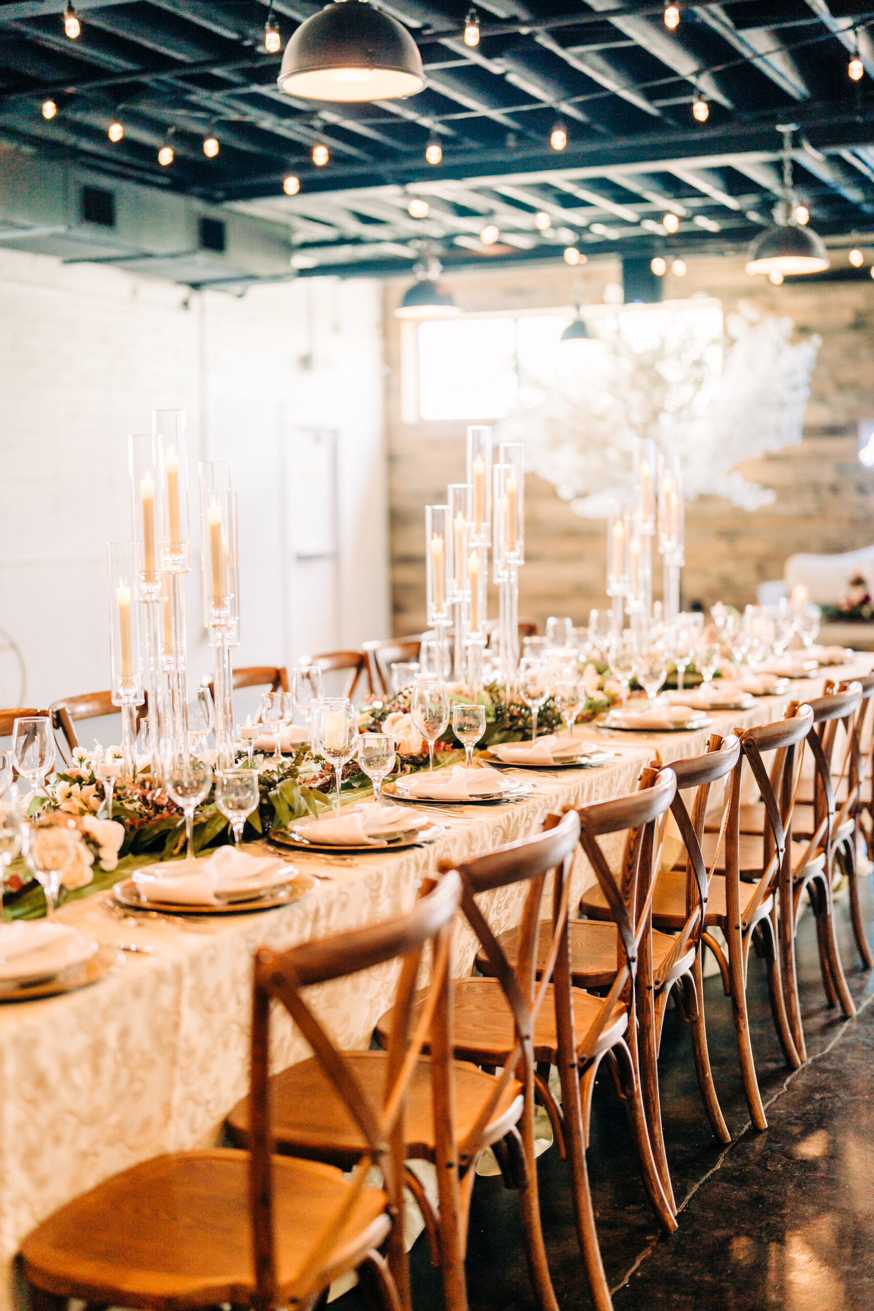 Elegant Wedding Spring Neutral Reception Decor Centerpiece Ideas | Long Feasting Tables with Glass Candelabra Centerpieces | Tampa Bay Rental Elite Events Catering | Venue The West Events