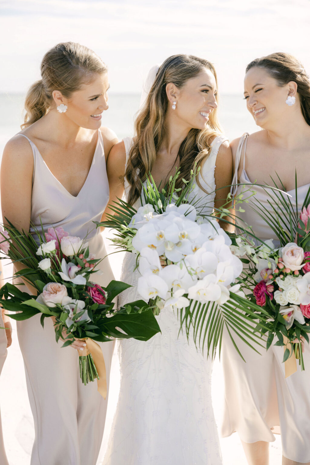 Tropical White Orchid, Palm Leaf,, Monstera, and Garden Rose Wedding Bouquet | Sarasota Florist Beneva Weddings and Events