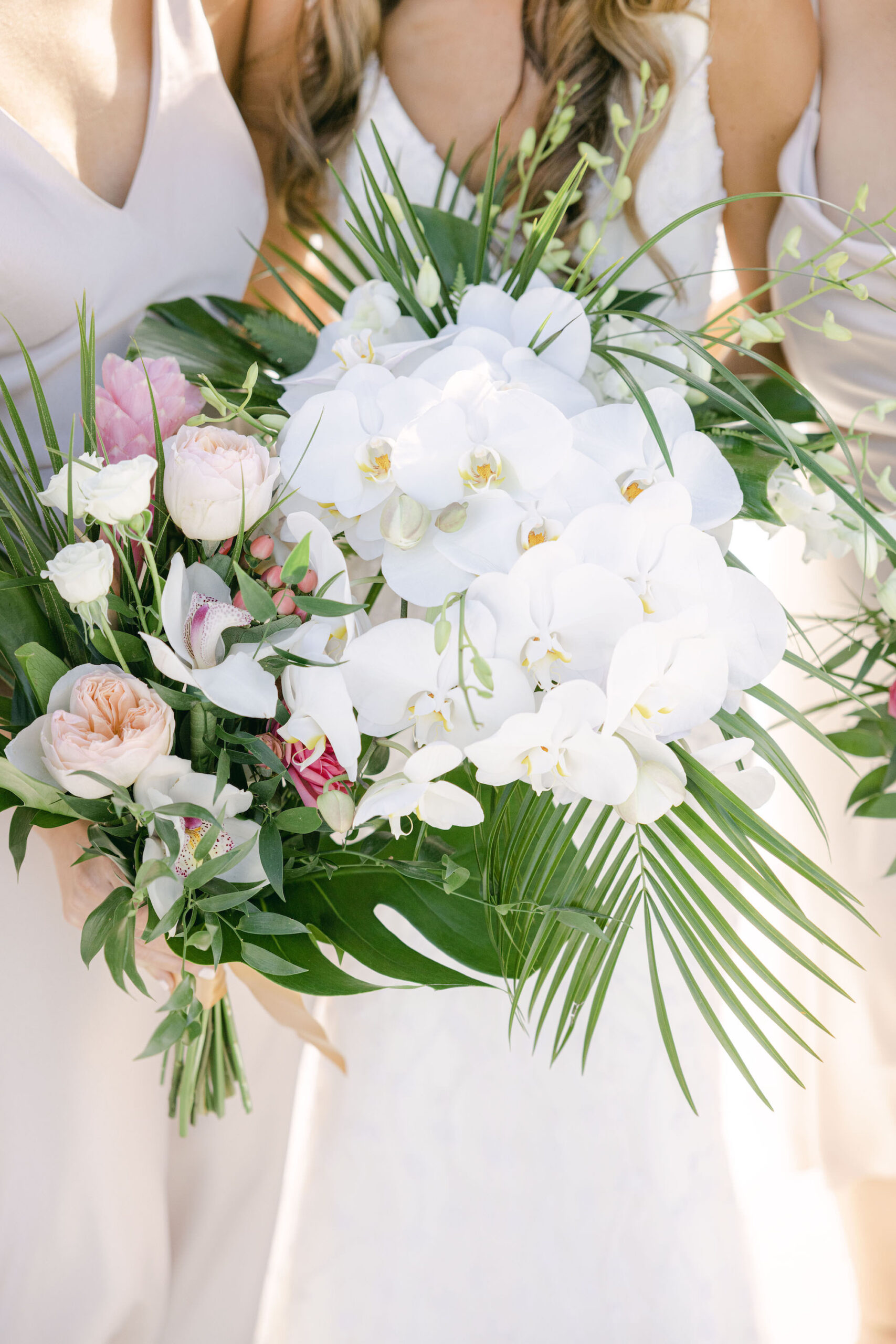 Tropical White Orchid, Palm Leaf, Monstera, and Garden Rose Wedding Bouquet Ideas | Sarasota Florist Beneva Weddings and Events