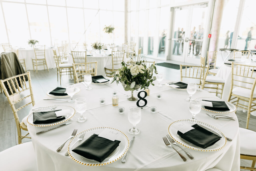 Modern Black, White, and Gold Wedding Reception Table Setting Inspiration | Beaded Gold Chargers and Chiavari Chairs | Tampa Bay Rentals Gabro Event Services | Caterer Amici's Catered Cuisine