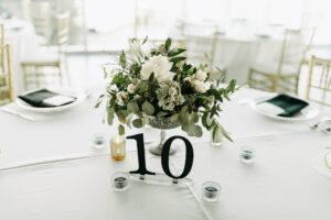 Modern Black Table Numbers with White Rose and Greenery Centerpiece Wedding Reception Table Decor Ideas