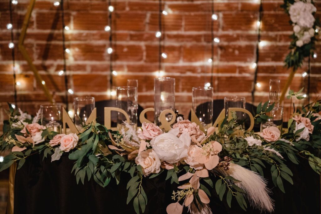 Black and Gold Wedding Reception Sweetheart Table Decor Ideas with Greenery
