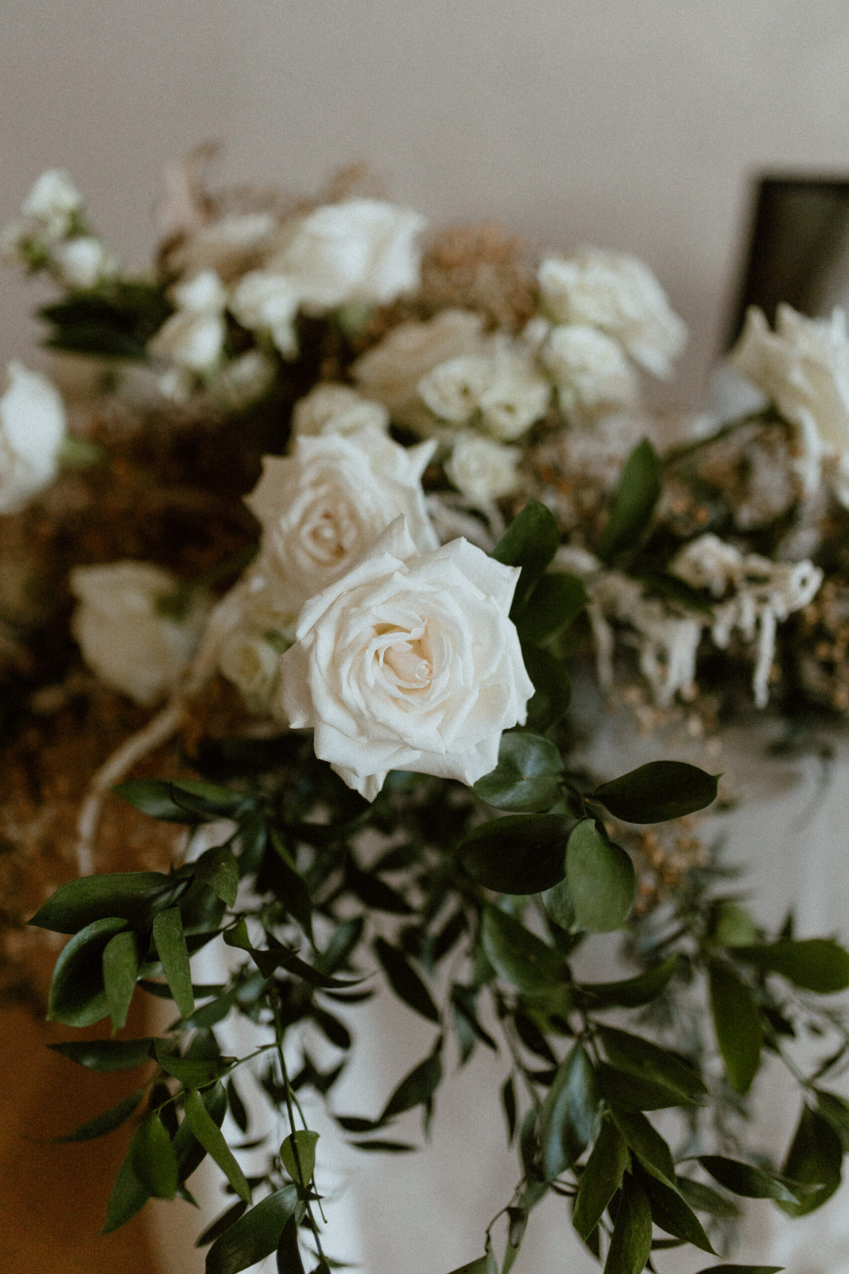 Romantic White and Cream Wedding Reception Floral Centerpieces with Greenery Detail