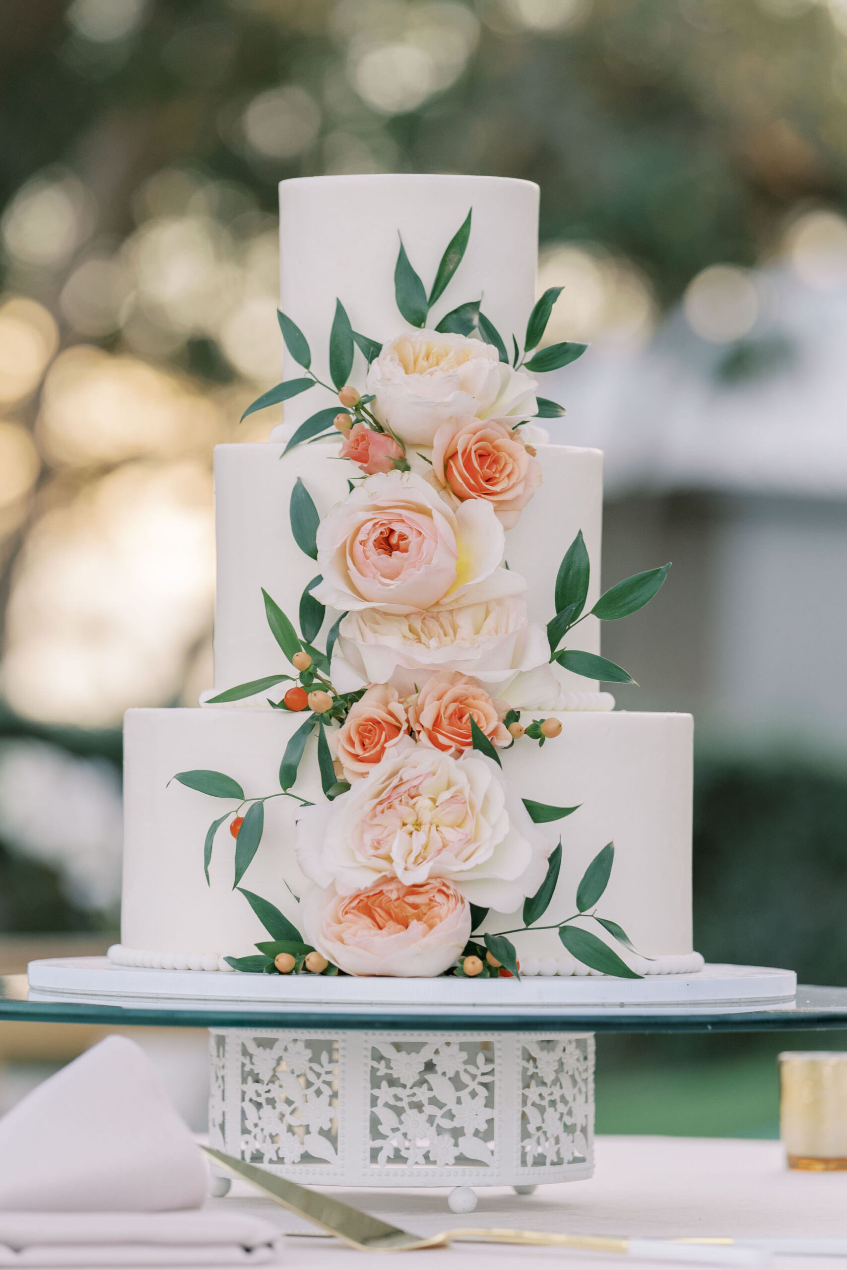Pink and Orange Garden Rose Accents on White Three-tiered Buttercream Wedding Cake Ideas