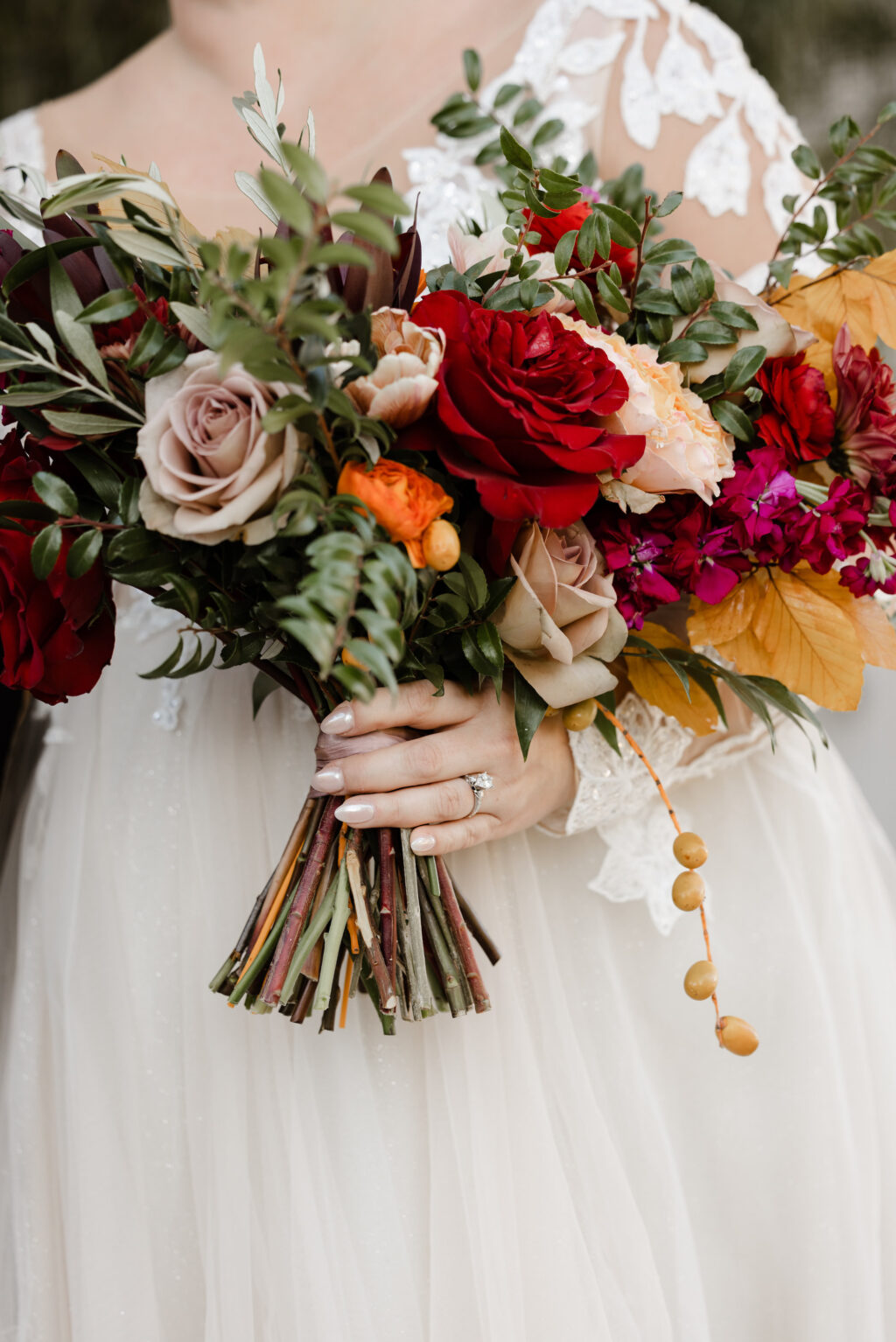 Brown Leaf, Maroon, Purple, and Orange Roses, Stock, Hypernicum Berry, and Greenery Bouquet Ideas | Dark and Moody Winter Wedding Inspiration