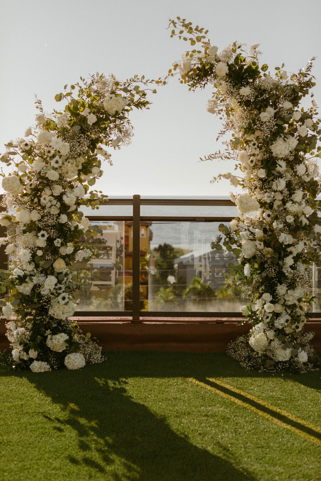 Split Ceremony Arch White Floral and Greenery Ideas | St. Pete Beach Rooftop Venue Wedding Hotel Zamora | Florist Lemon Drops Wedding & Events