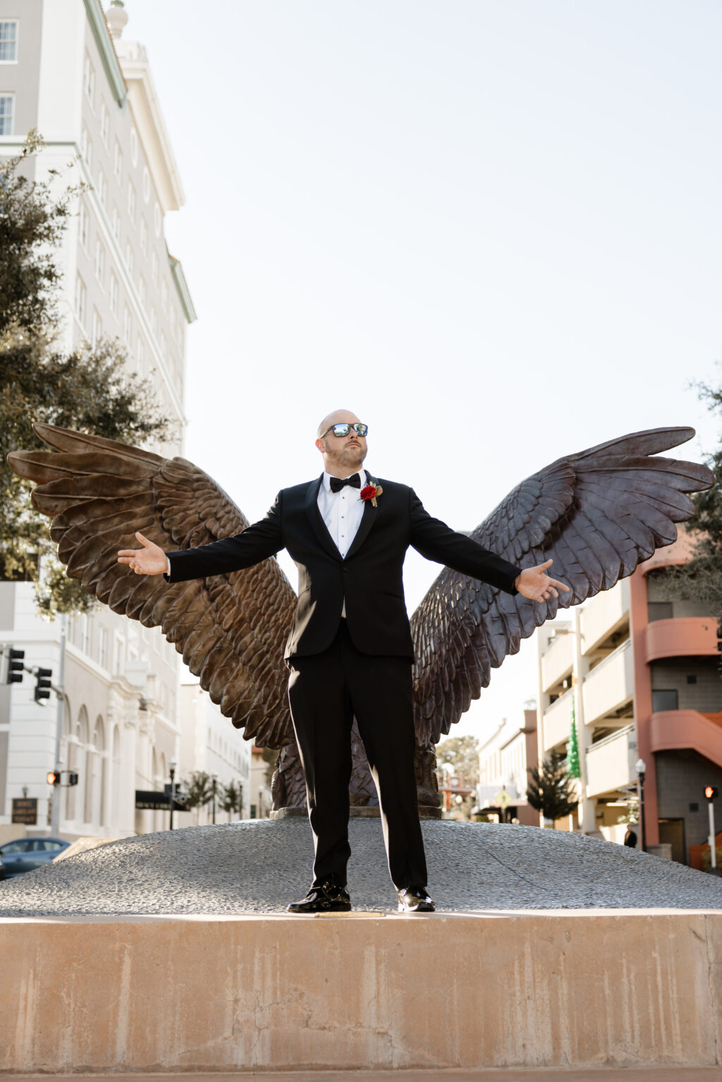 Groom with Eagle Wings Wedding Portrait