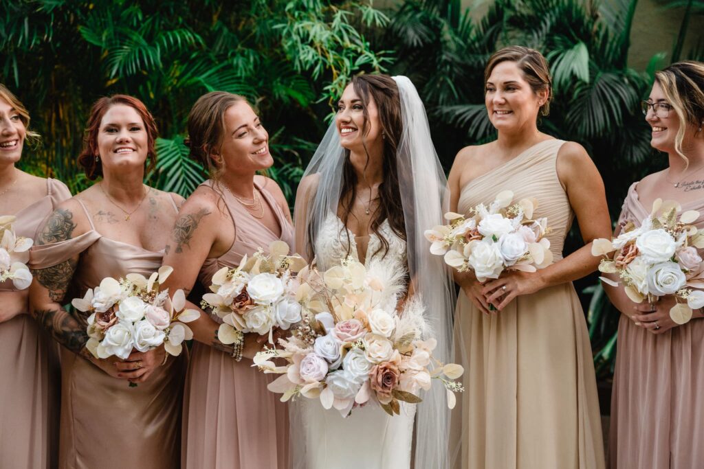 Bride with Bridesmaids in Mix and Match Blush and Nude Bridesmaids Dresses Wedding Portrait