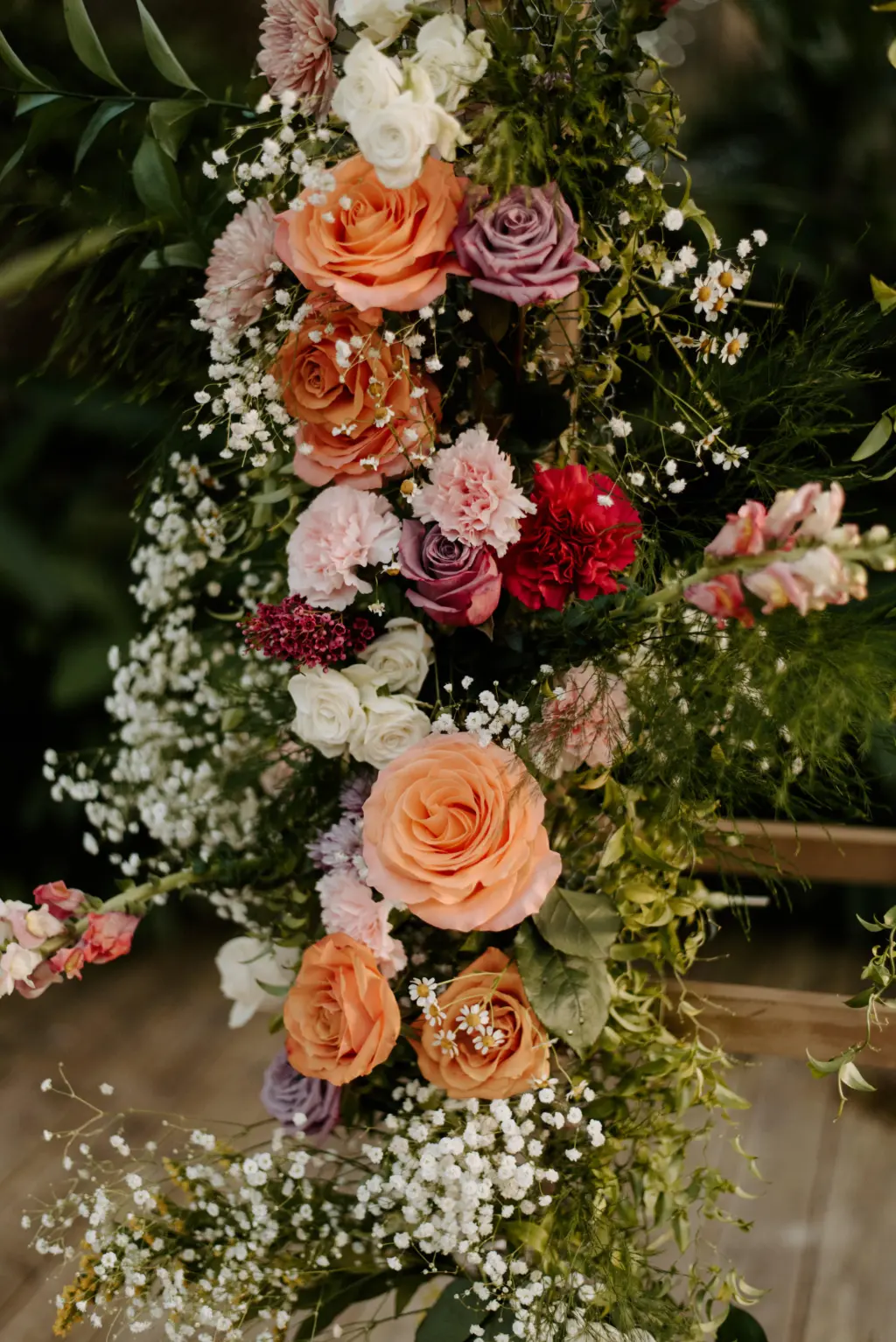 Orange, Blush, and Red Wedding Ceremony Florals with Greenery and Baby's Breath Inspiration