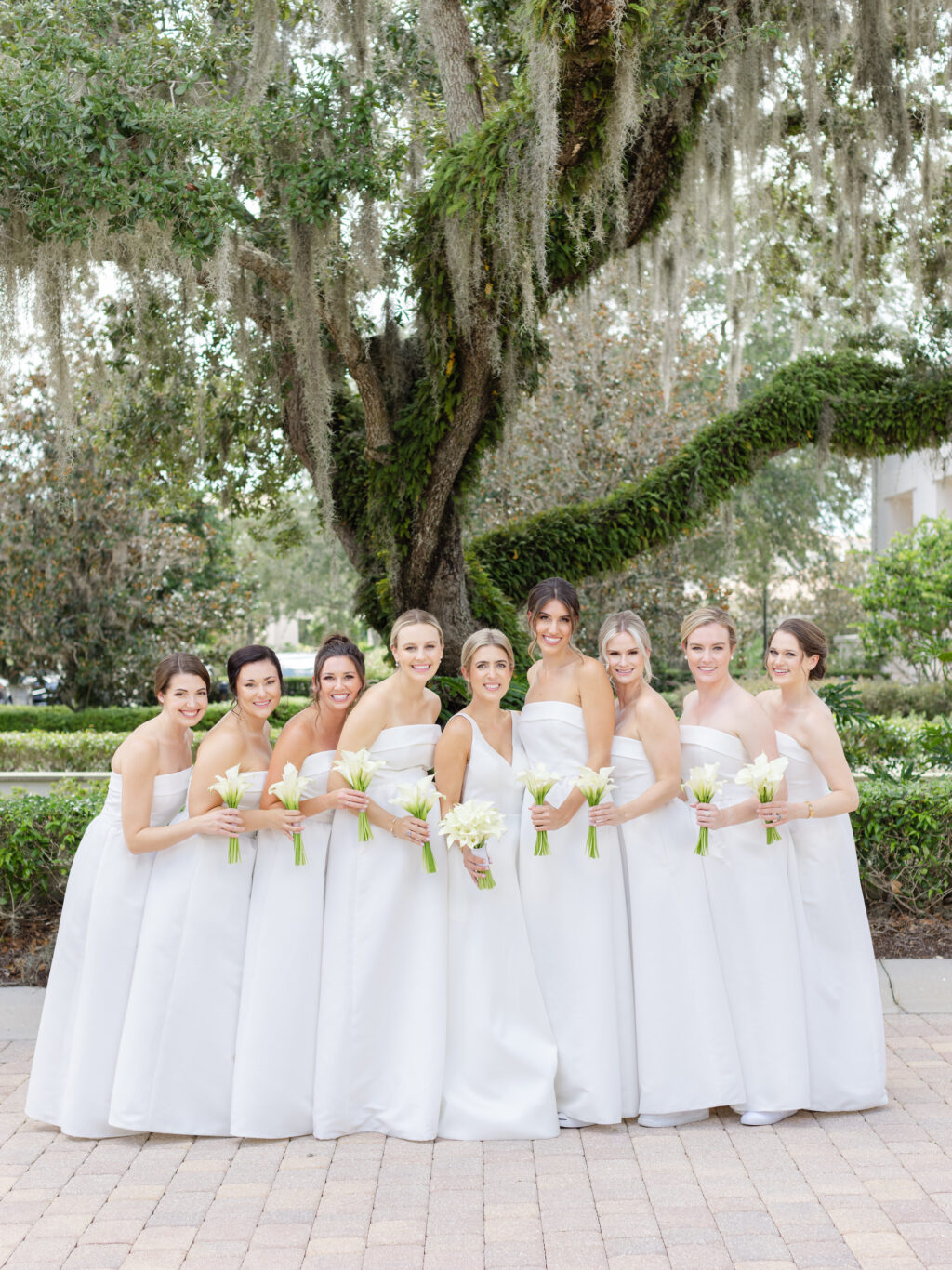All-White Amsale Bella Bridesmaids Strapless Dress Ideas with Classic Cala Lily Bouquets
