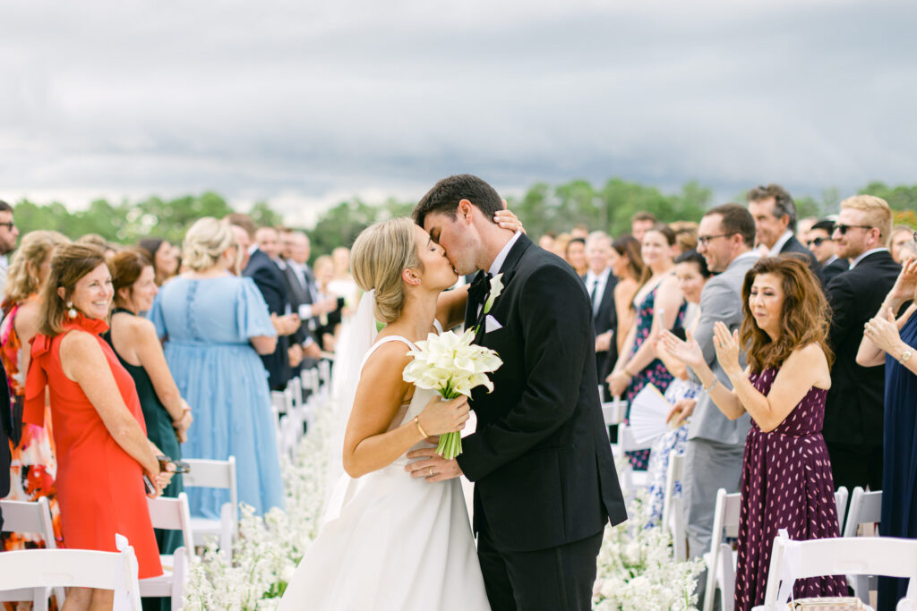 Bride and Groom Aisle Kiss Wedding Portrait