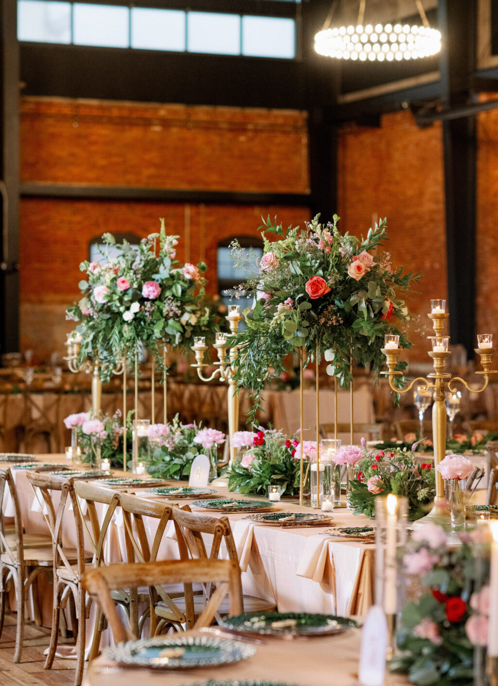 Gold Candelabra | Pink, Red, and White Roses with Eucalyptus Greenery in Gold Tall Stands | Long Feasting Tables | Indian Wedding Reception Decor Inspiration | Tampa Bay Rental A Chair Affair