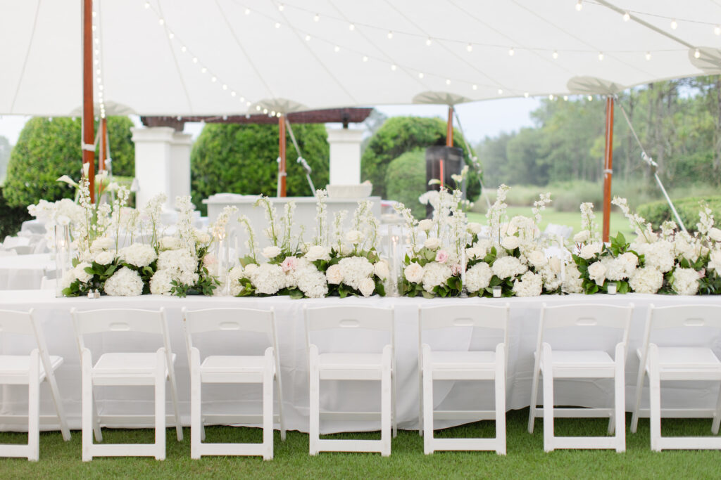 Timeless White Stock, Garden Roses, and Hydrangeas Feasting Table Centerpieces | Sailcloth Tent | Timeless Wedding Reception Inspiration