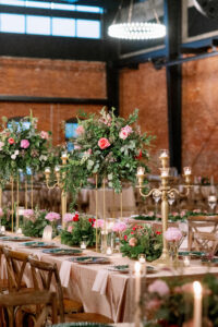 Indian Wedding Reception Décor Inspiration | Gold Candelabra | Pink, Red, and White Roses with Eucalyptus Greenery in Gold Tall Stands | Long Feasting Tables | Tampa Bay Rental A Chair Affair