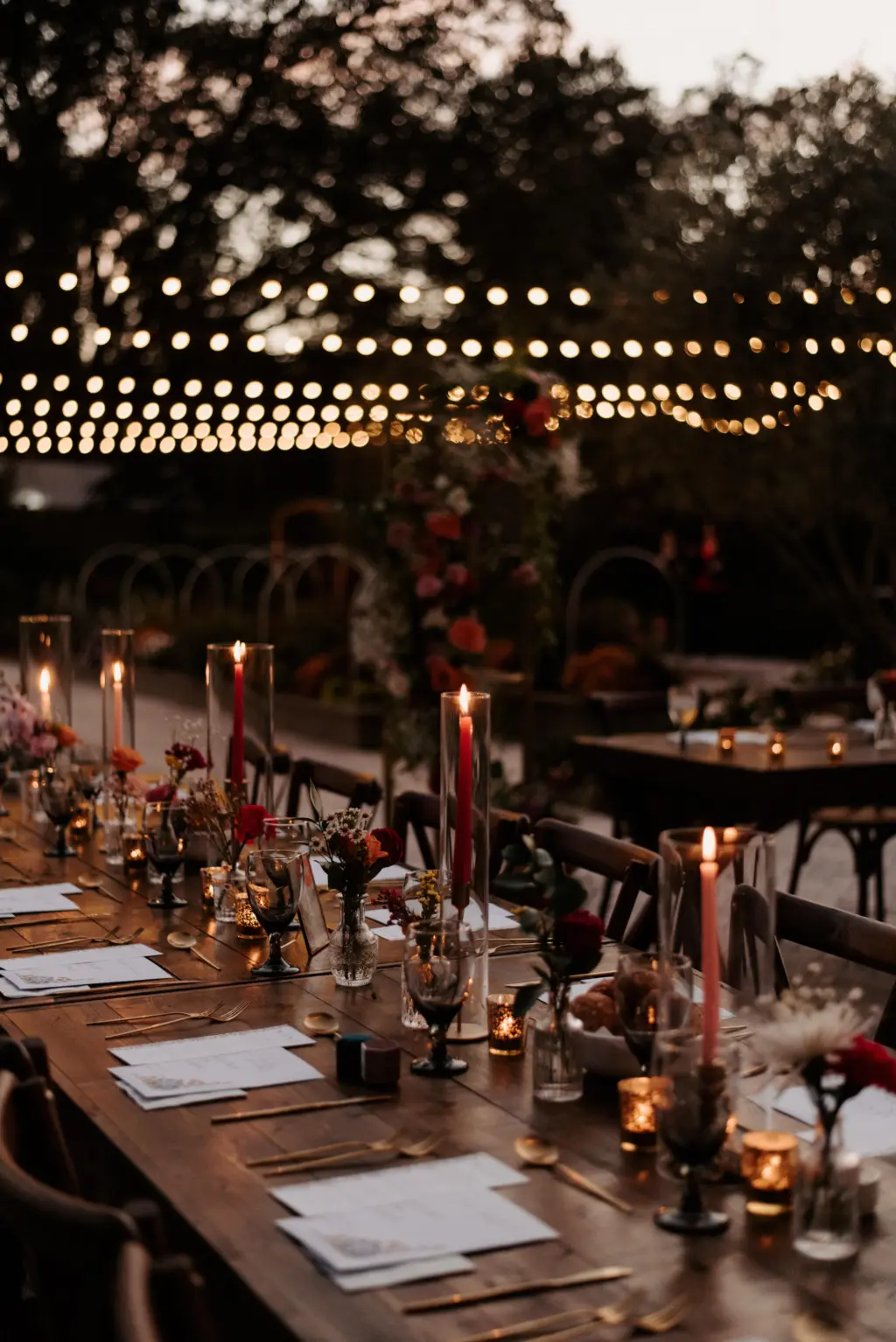 Garden Party Dark and Moody Wedding Reception with Bistro Lights and Tapered Candles Tablescape Decor | Tampa Wedding Venue Mill Pond Estate | Planner Tampa Stephany Perry Events | Caterer Elite Event Catering