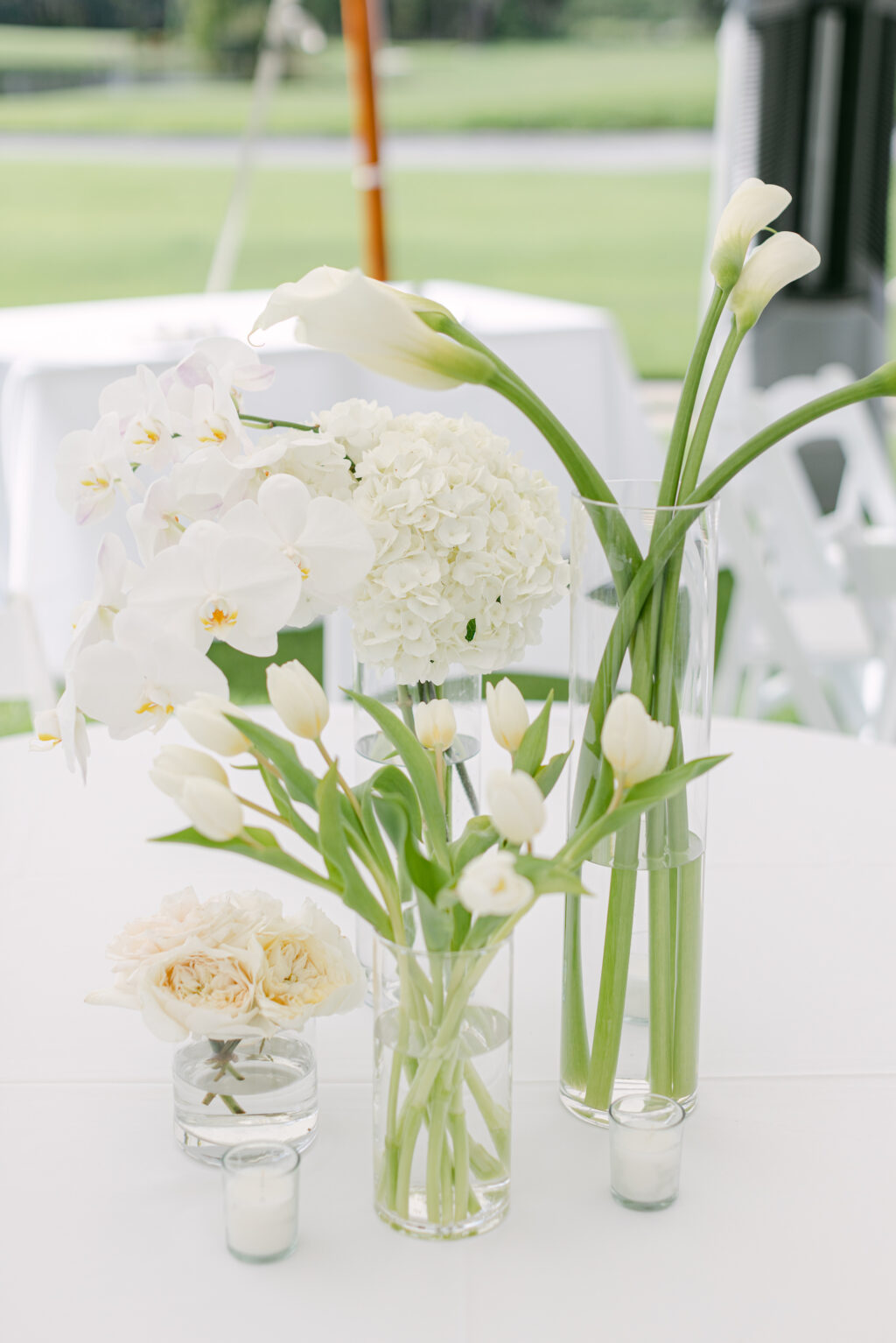 Classic White Calla Lilly, Garden Roses, Hydrangeas, Tulips, and Orchid Centerpieces | Garden Wedding Inspiration