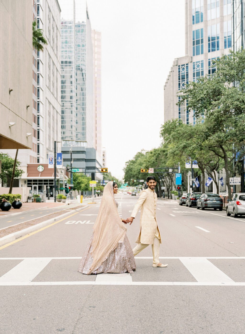 Bide and Groom Walking Across Street Wedding Portrait | Tampa Bay Videographer Shannon Kelly Films | Photographer Dewitt For Love