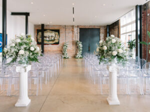 Asymmetrical Wedding Ceremony Floral Altar with Baby's Breath and White Rose Ideas | Ghost Chairs | YborVenue Hotel Haya | Tampa Bay Kate Ryan Event Rentals | Planner Olive Tree Weddings