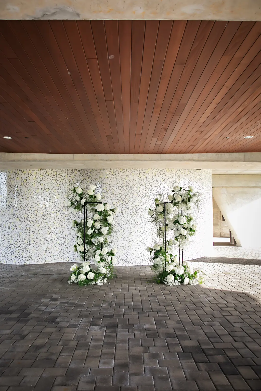Black Metal Flower Stand with White Hydrangeas, Baby's Breath, and Greenery | Modern Wedding Ceremony Altar Decor Ideas