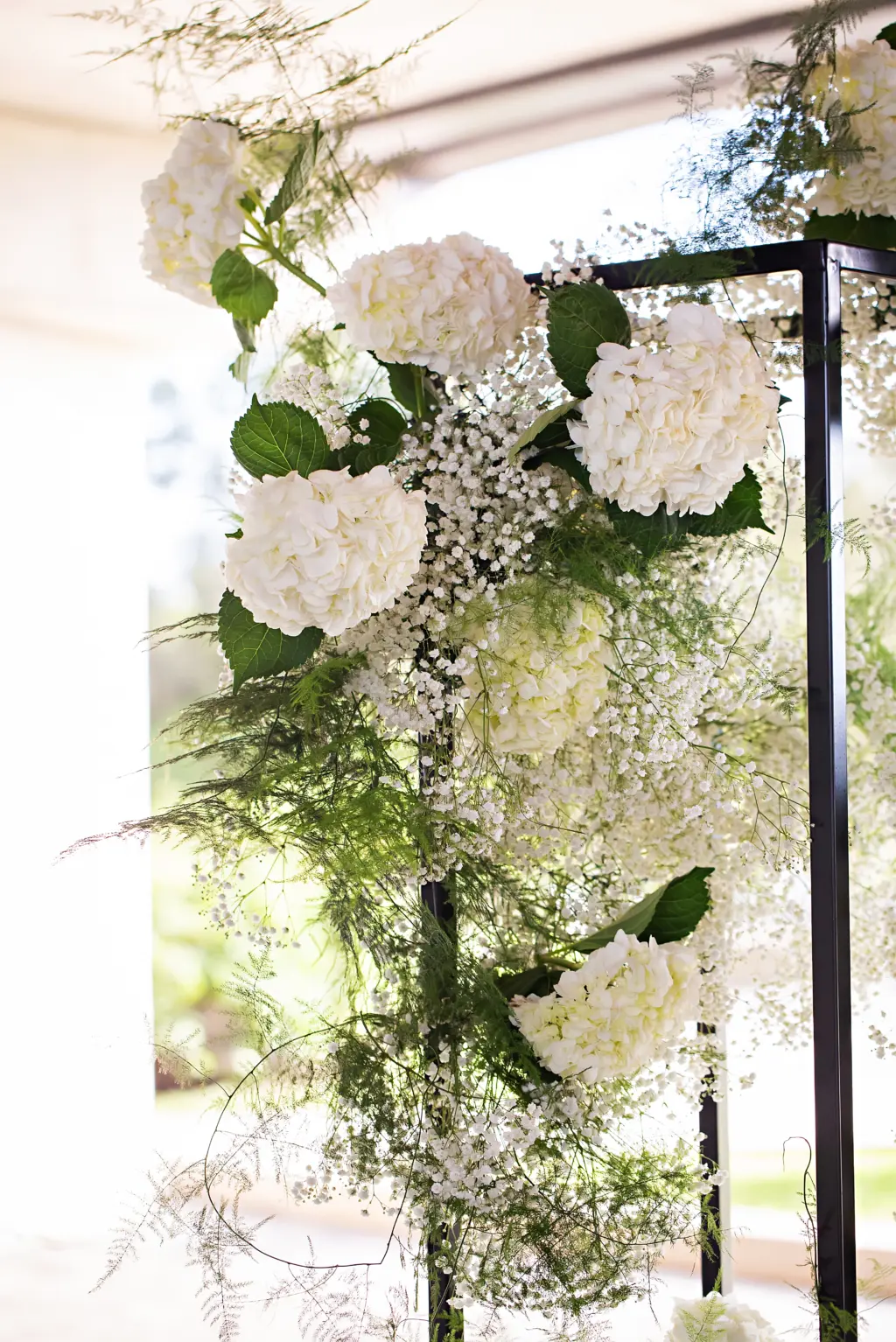 White Hydrangeas, Baby's Breath, and Greenery Wedding Ceremony Altar Flower Arrangement Ideas