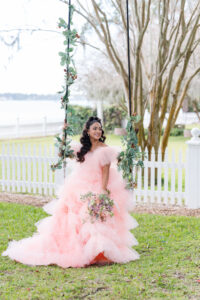 Off-the-shoulder Pink Layered Tulle Wedding Dress Inspiration | Swing Flower Arrangement | Pink and Orange Garden Roses with Greenery Bouquet Ideas | Sarasota Florist Save The Date Florida | Planner MDP Events | Photographer Amanda Zabrocki Photography