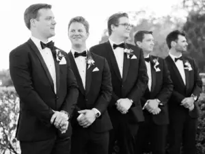 Groom and Groomsmen Reacting to Bride Walking Down Wedding Aisle