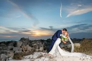 Bride and Groom Clearwater Beach Sunset Kiss Wedding Portrait | Tampa Bay Photographer Limelight Photography