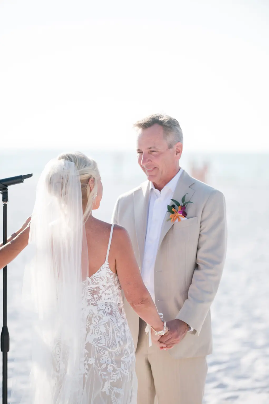 Bride and Groom Exchange Vows During Wedding Beach Ceremony